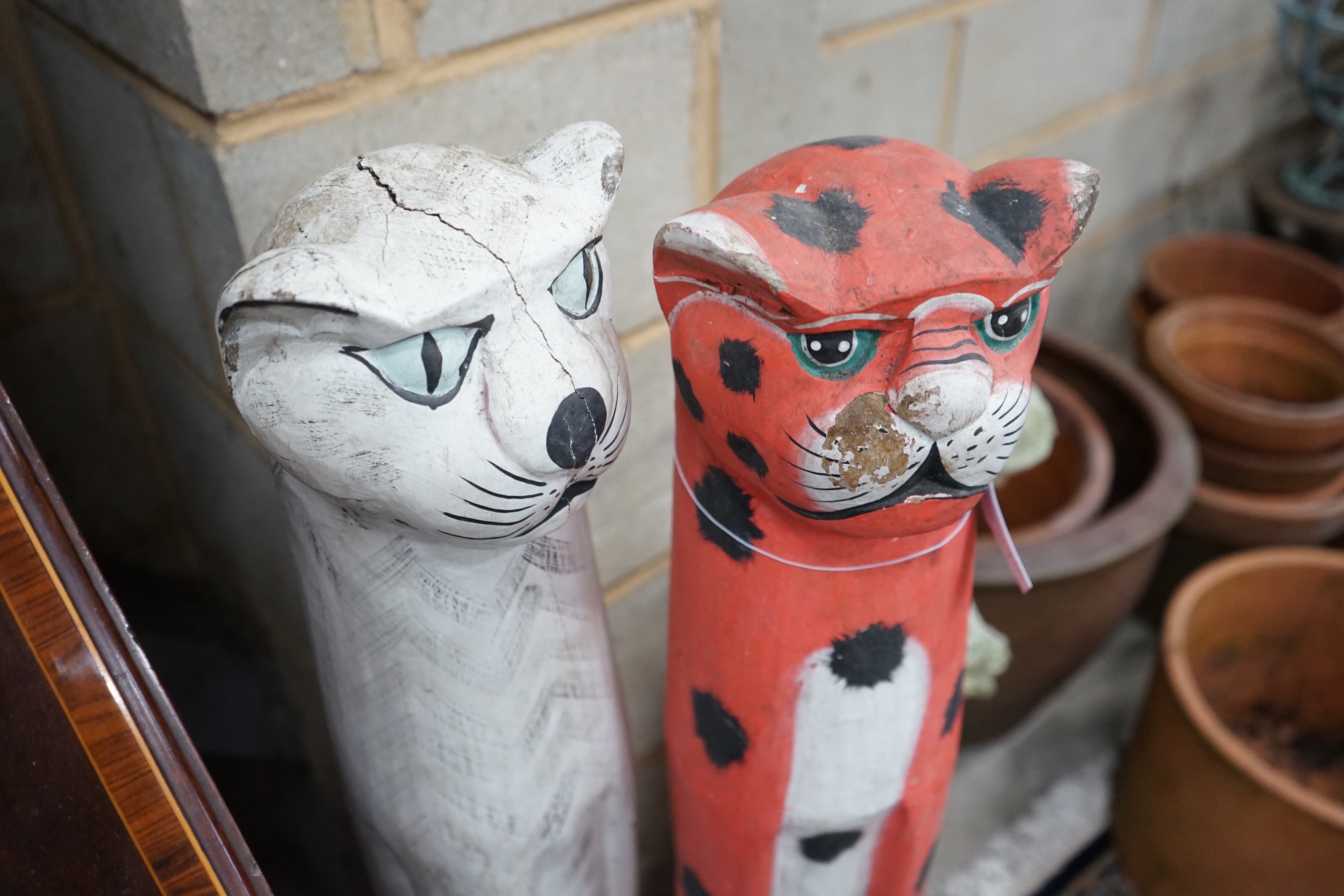A pair of painted carved wood cats, height 100cm